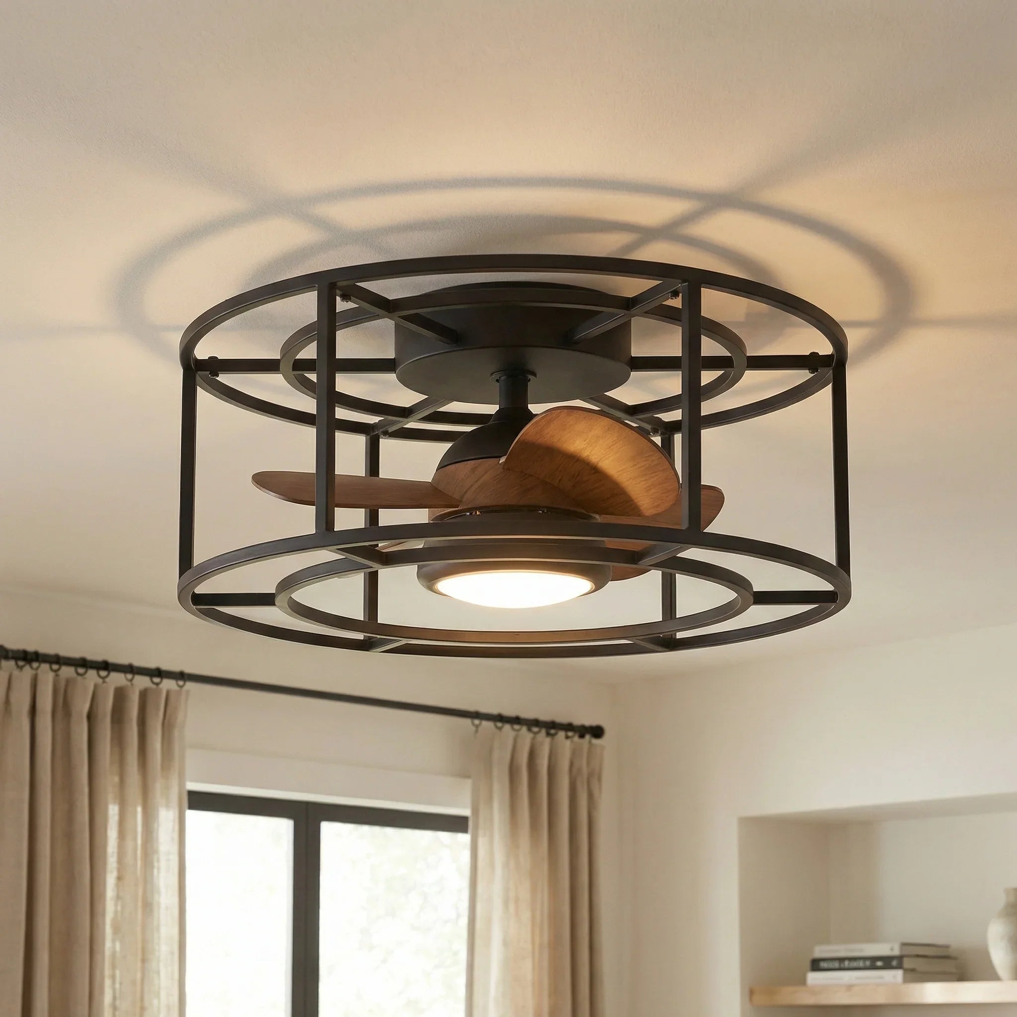 Black flush-mount ceiling fan LED light glowing, bronze blades inside circular metal frame