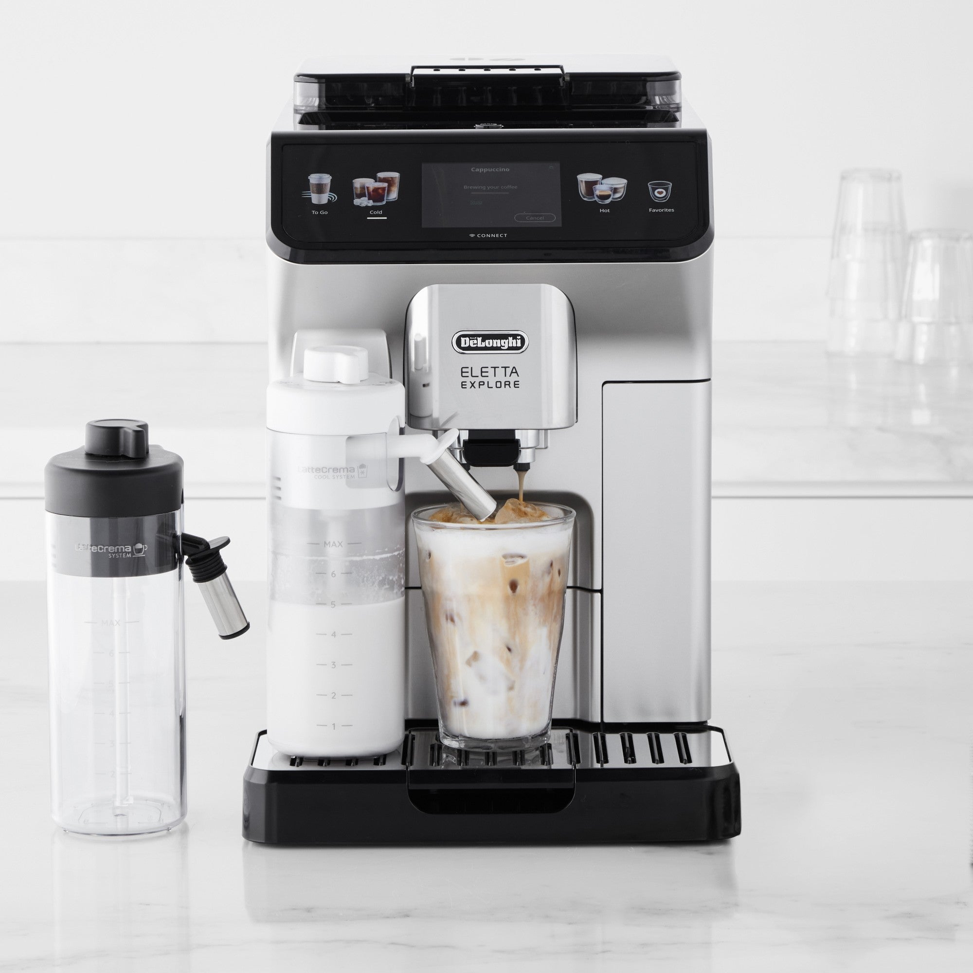 Fully automatic espresso machine with cold brew and milk container, front studio view