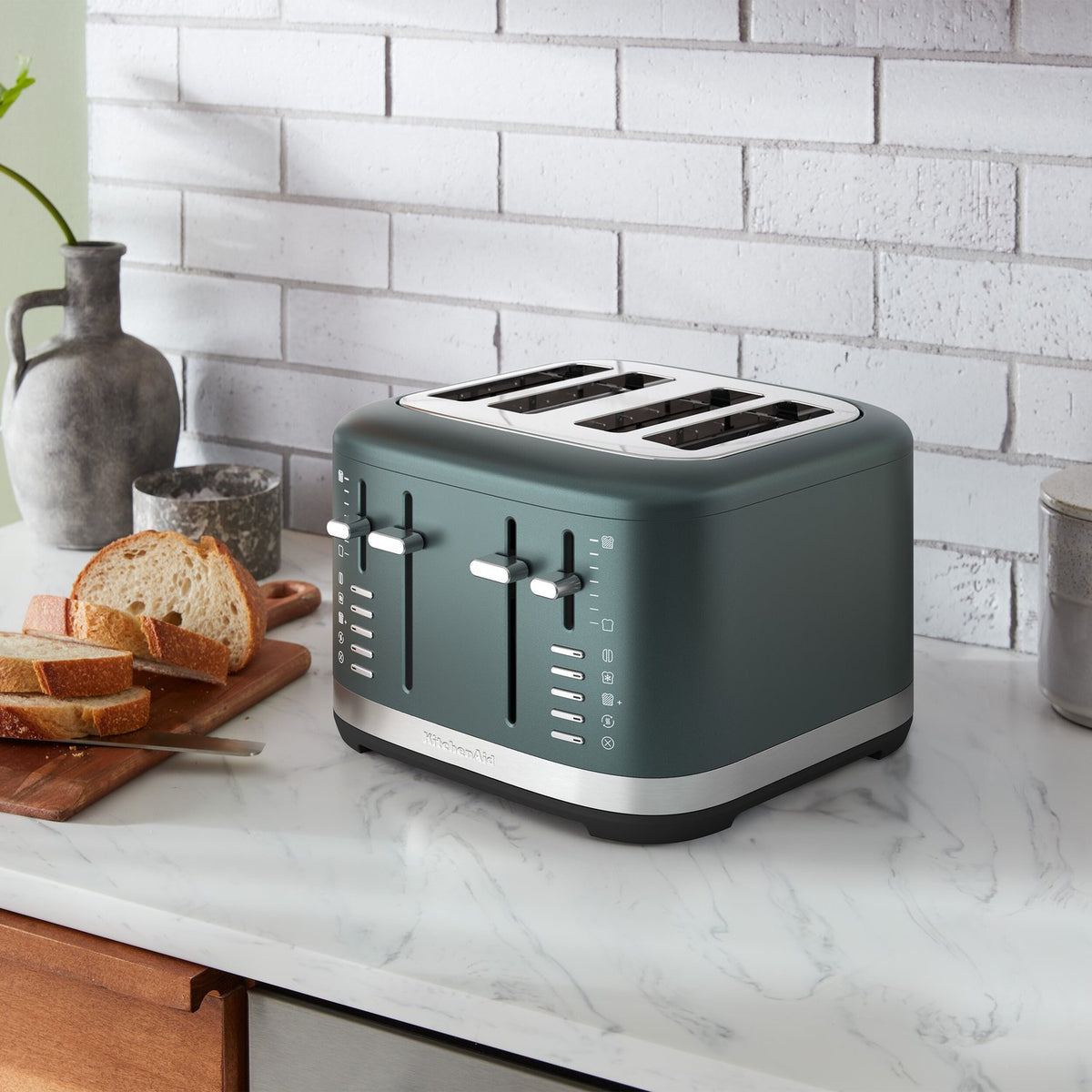Juniper 4-slice toaster on countertop, top slots and front control knobs