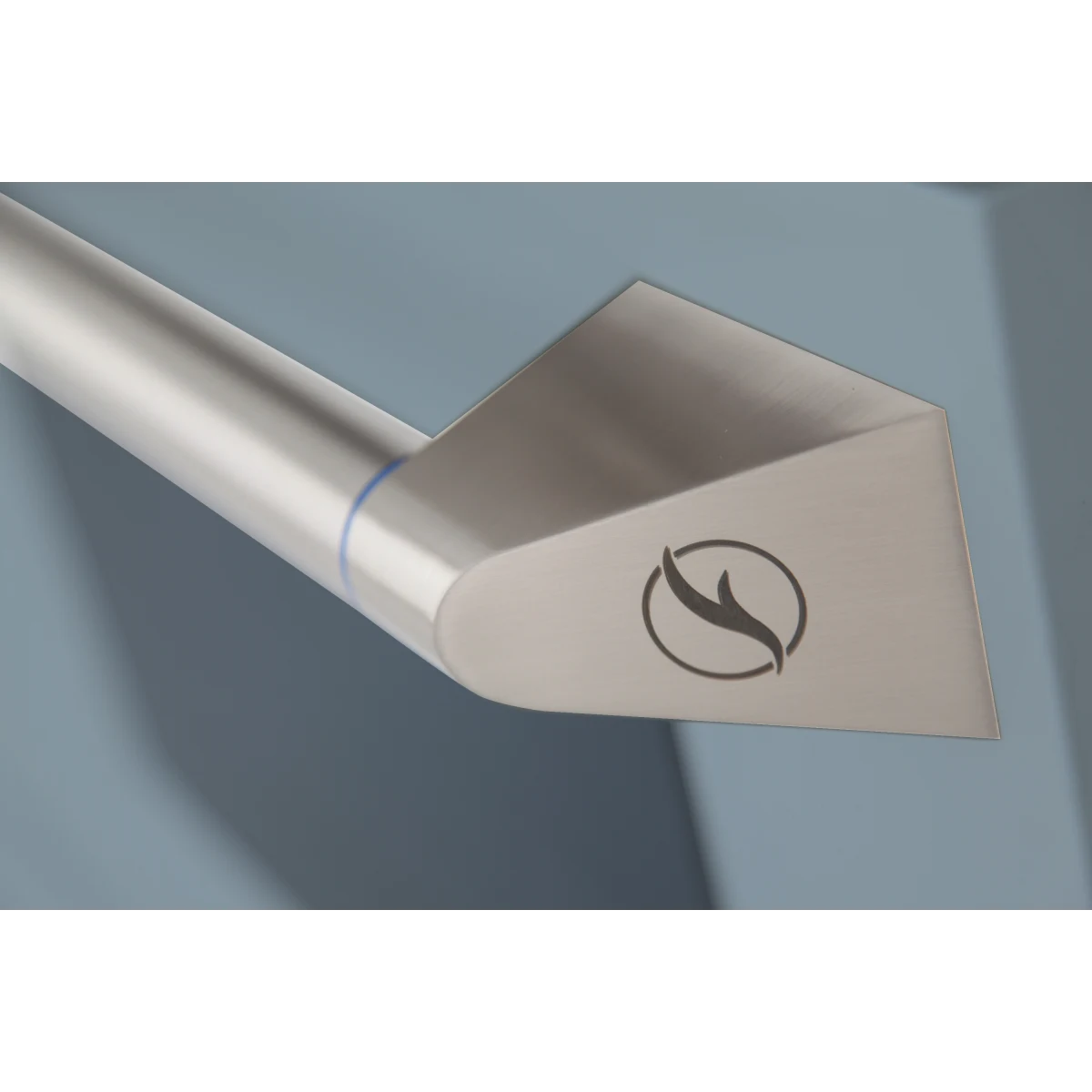 Kucht range oven handle with flame icon on light-colored front rail