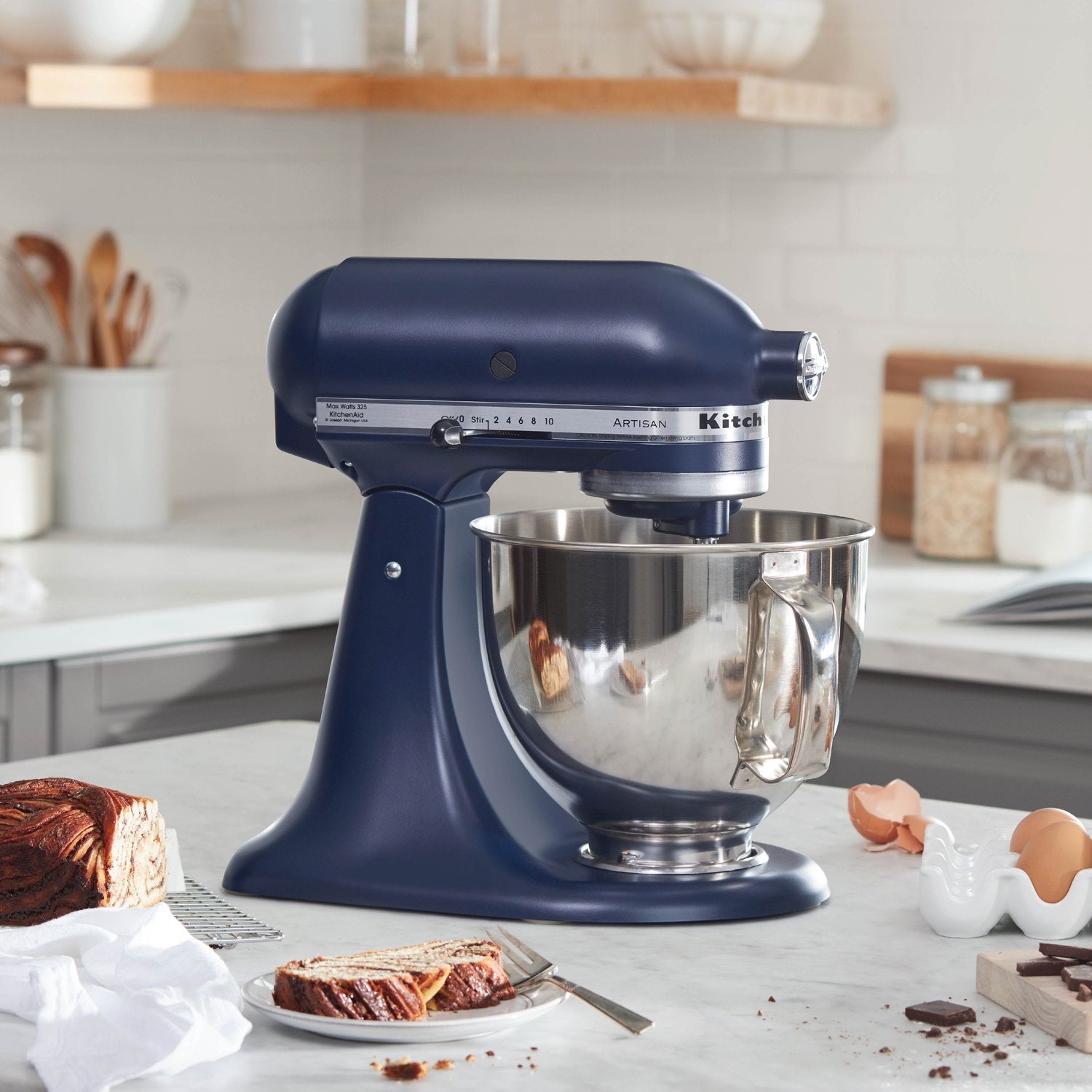 KitchenAid stand mixer with stainless mixing bowl and mixing attachment