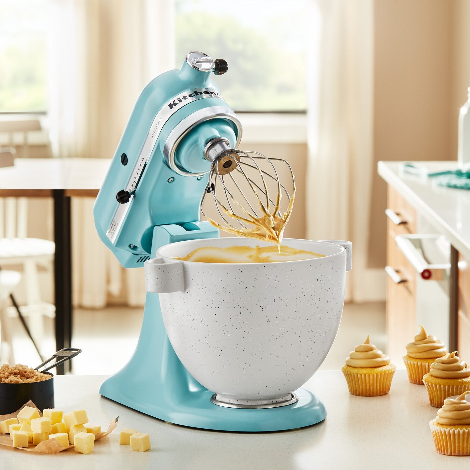Ceramic mixing bowl with speckled stone finish on stand mixer, white