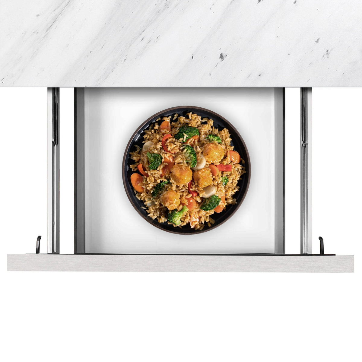 Stainless steel oven interior with black pan holding a cooked meal