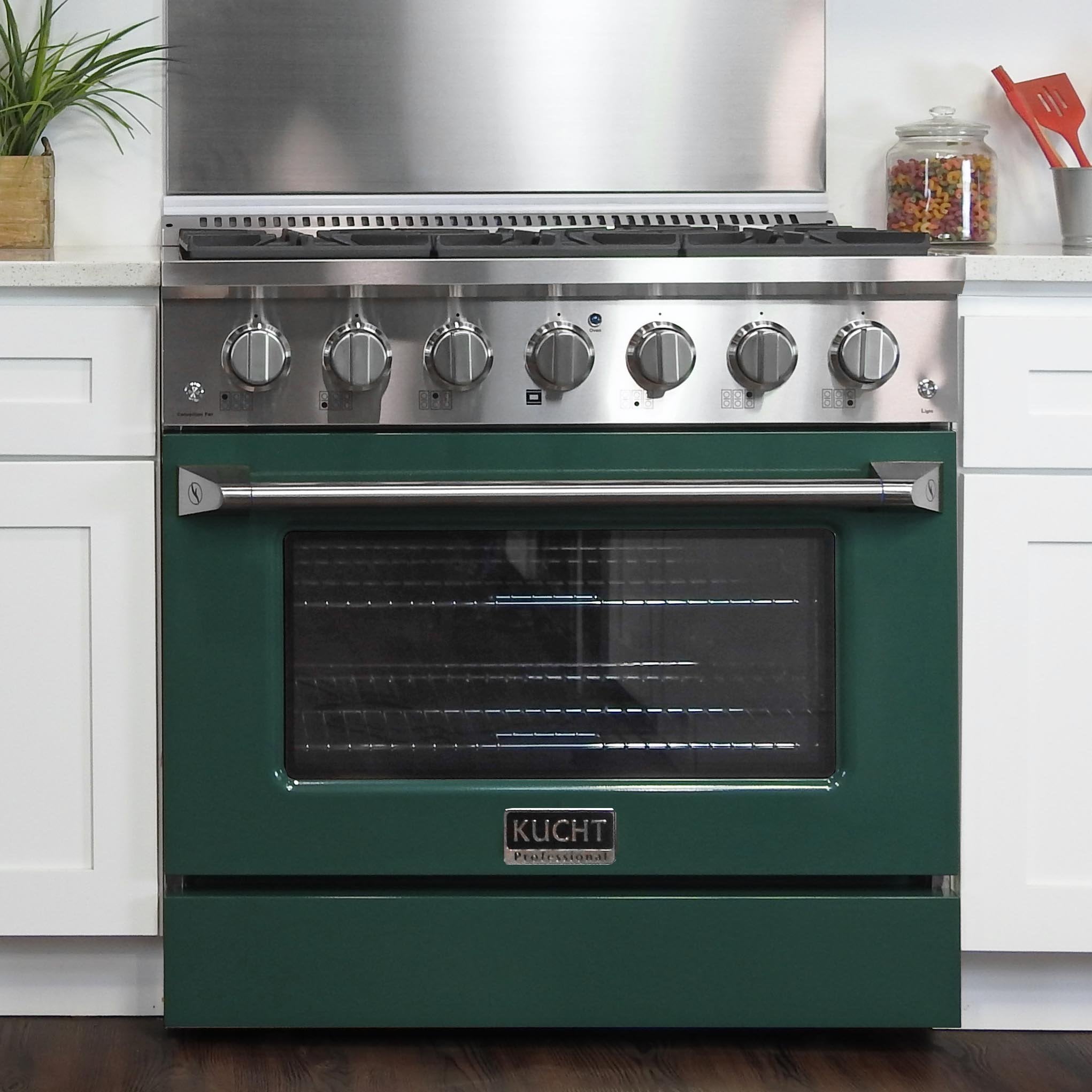 Green 36-inch gas range with stainless cooktop, burner knobs, and oven door.