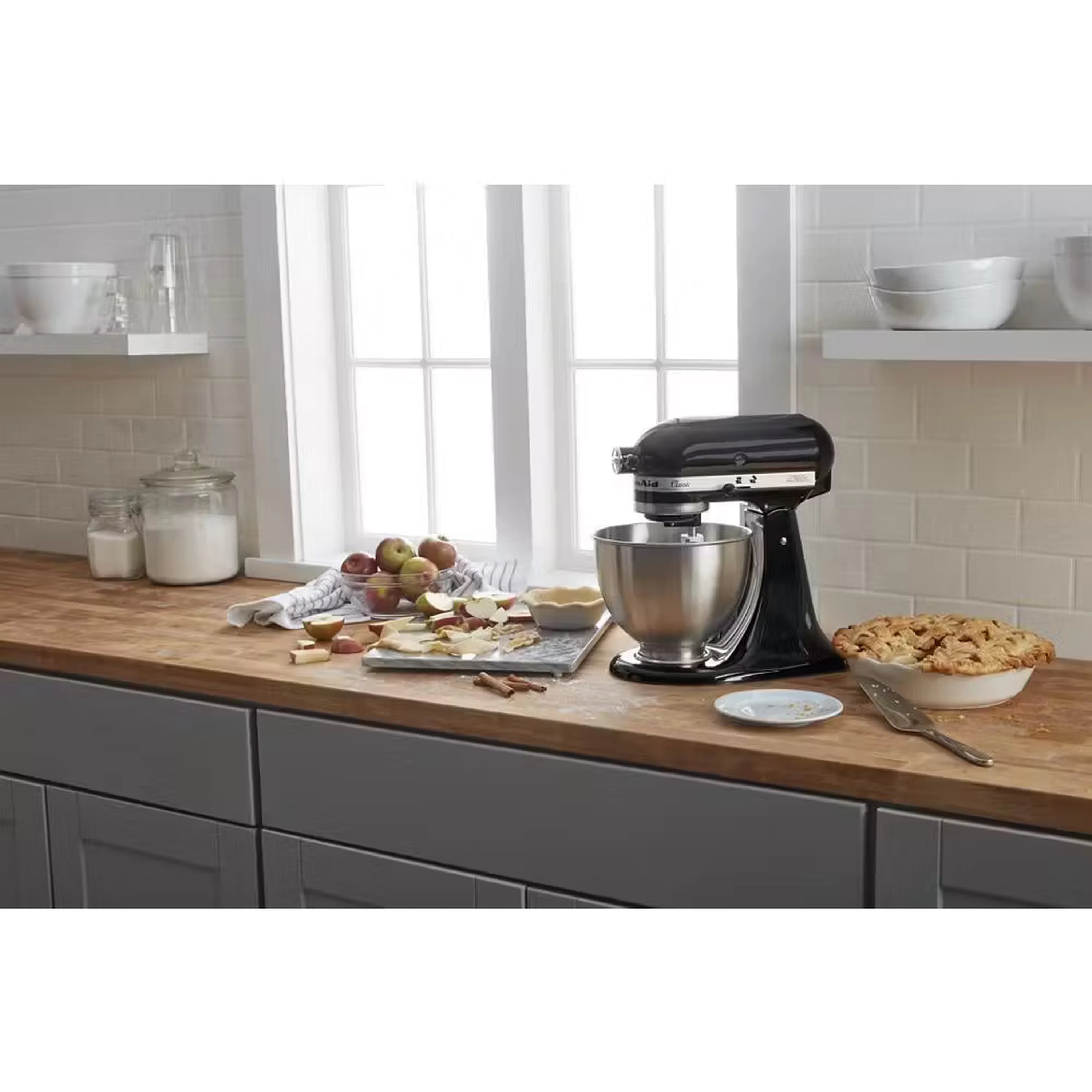 Onyx black stand mixer on kitchen counter with stainless bowl