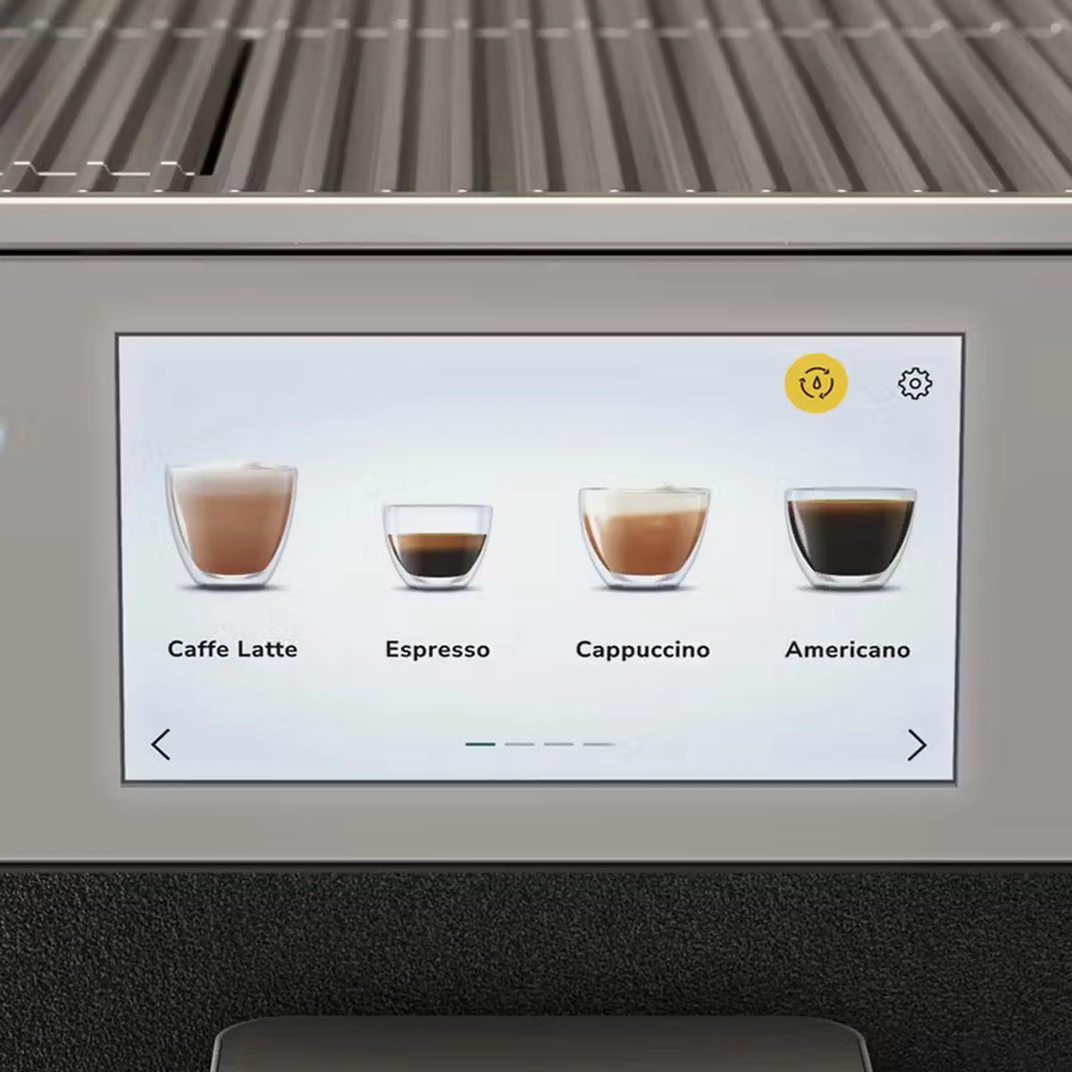 Fully automatic espresso machine touchscreen with drink icons and navigation arrows