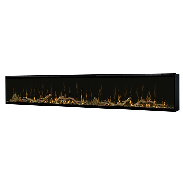 Linear electric fireplace insert with flames over driftwood logs and river rock stones
