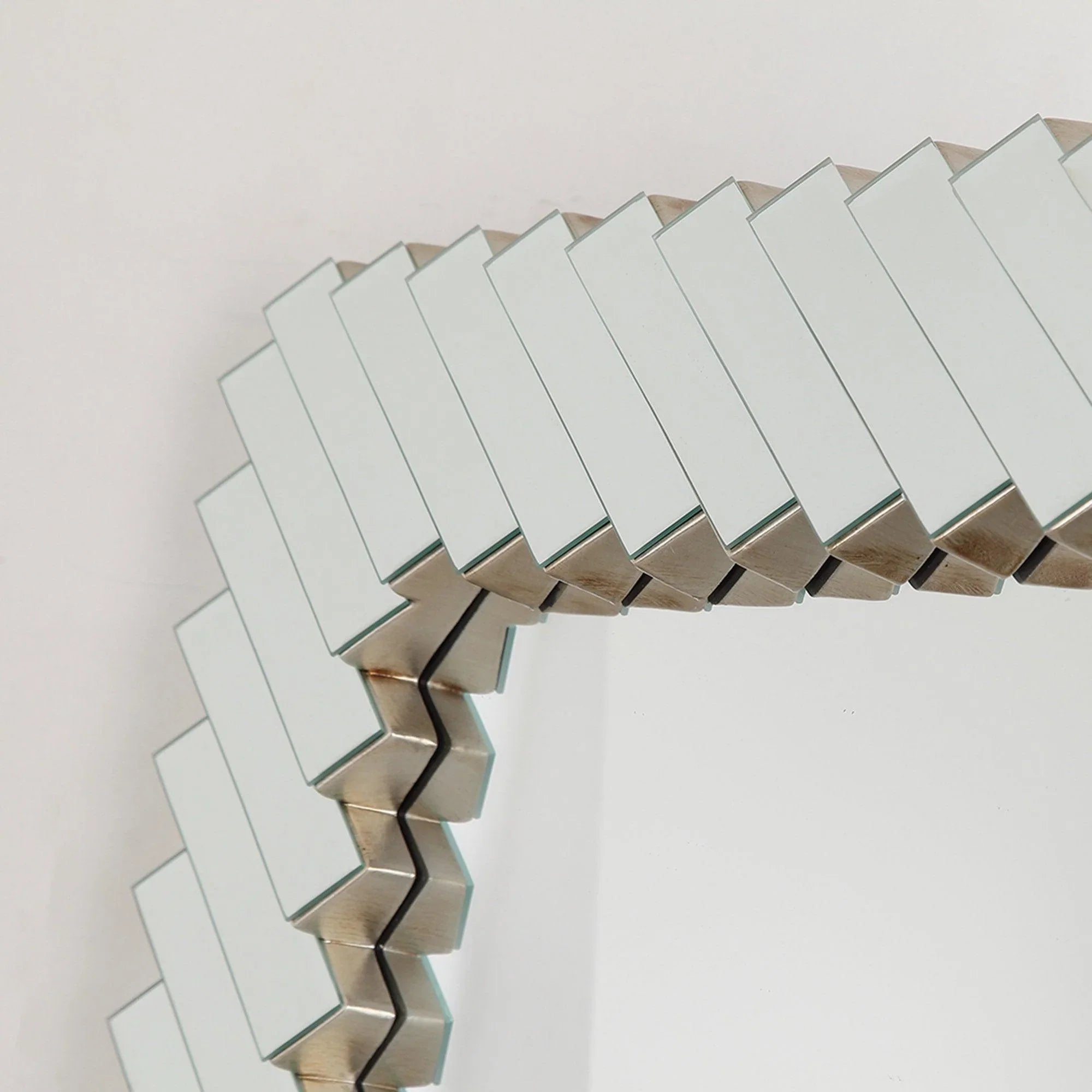 Close-up of silver slat frame on a rectangular decorative mirror