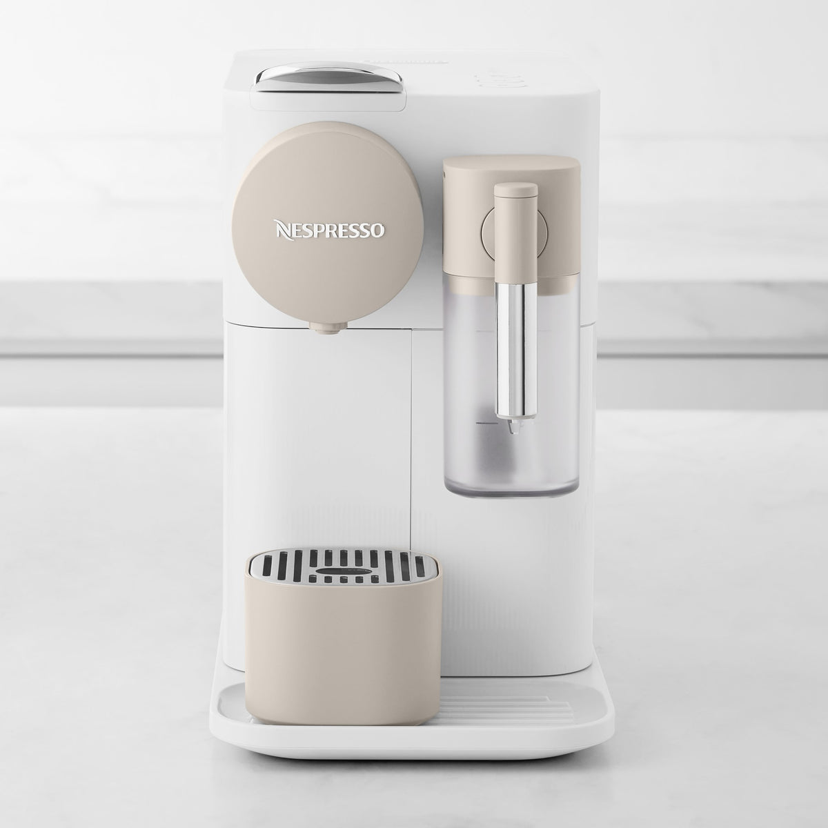 White coffee machine front view with frother wand and milk container, drip tray