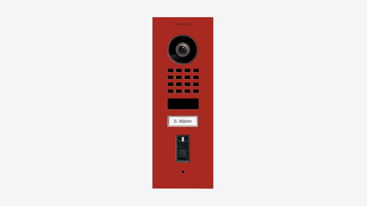 Flush-mount video door station in flame red with camera lens, speaker grille, and name plate