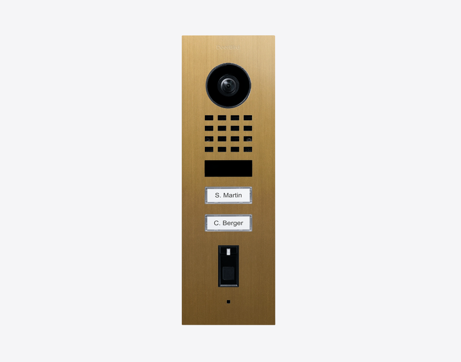 DoorBird gold flush-mount video door station with camera lens and keypad