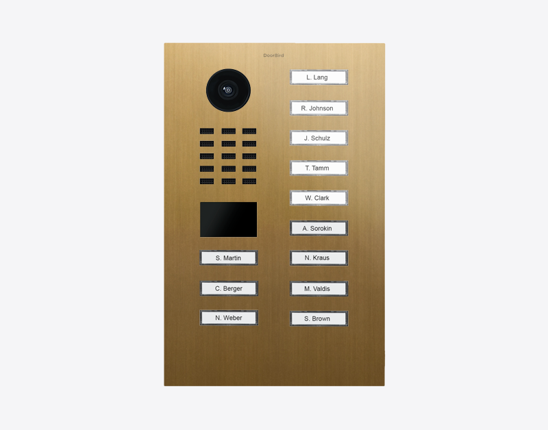 DoorBird IP video door station in gold with round camera and 12 call button labels