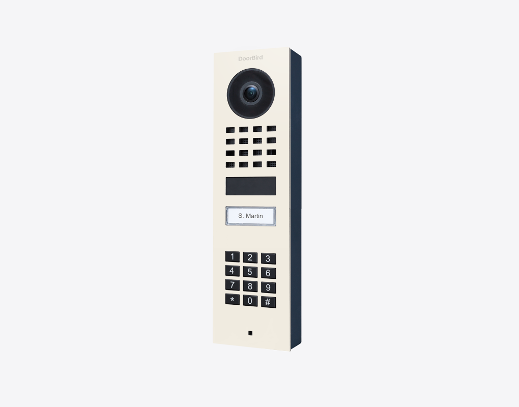 DoorBird surface-mount IP video door station in pure white with camera lens and keypad
