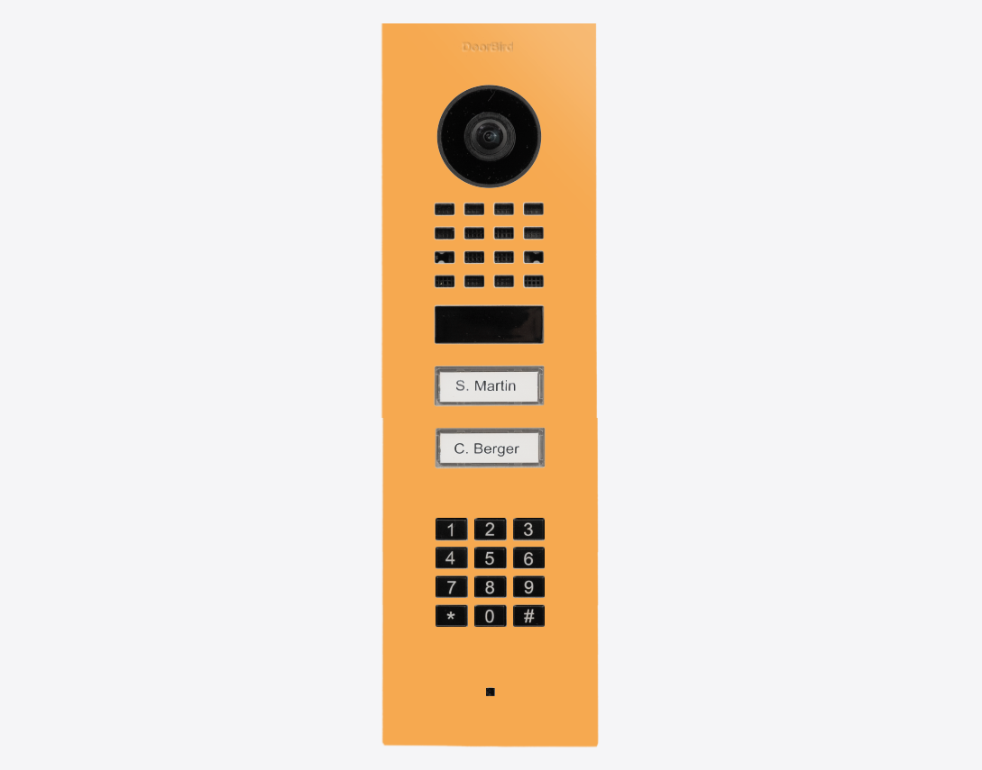 DoorBird flush mount IP video door station in saffron yellow with camera, keypad, call buttons