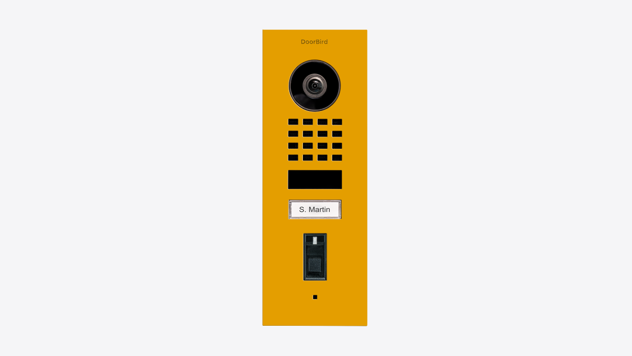 Golden yellow flush-mount video door station with camera lens, speaker grill, and keypad
