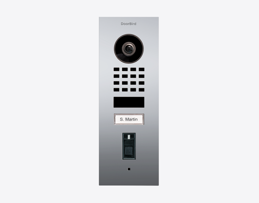 DoorBird fingerprint video door station in chrome with camera lens, keypad, and nameplate