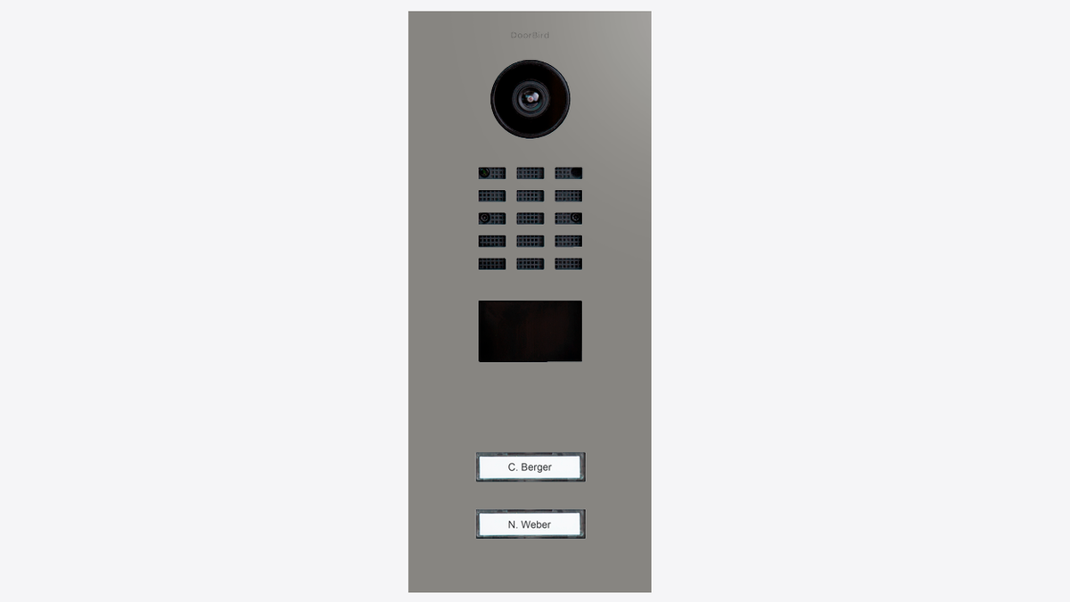 DoorBird grey aluminium door station with camera lens, keypad grid, and two labels