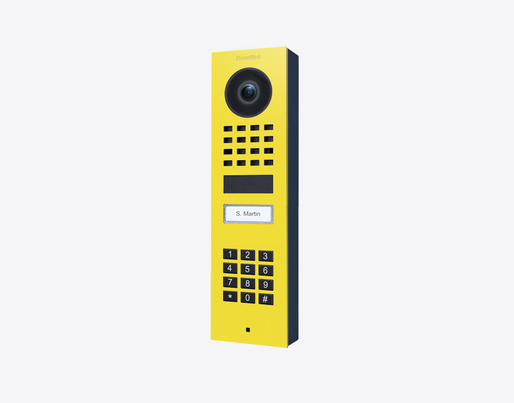 DoorBird video door station, sulfur yellow, with camera lens and keypad call button