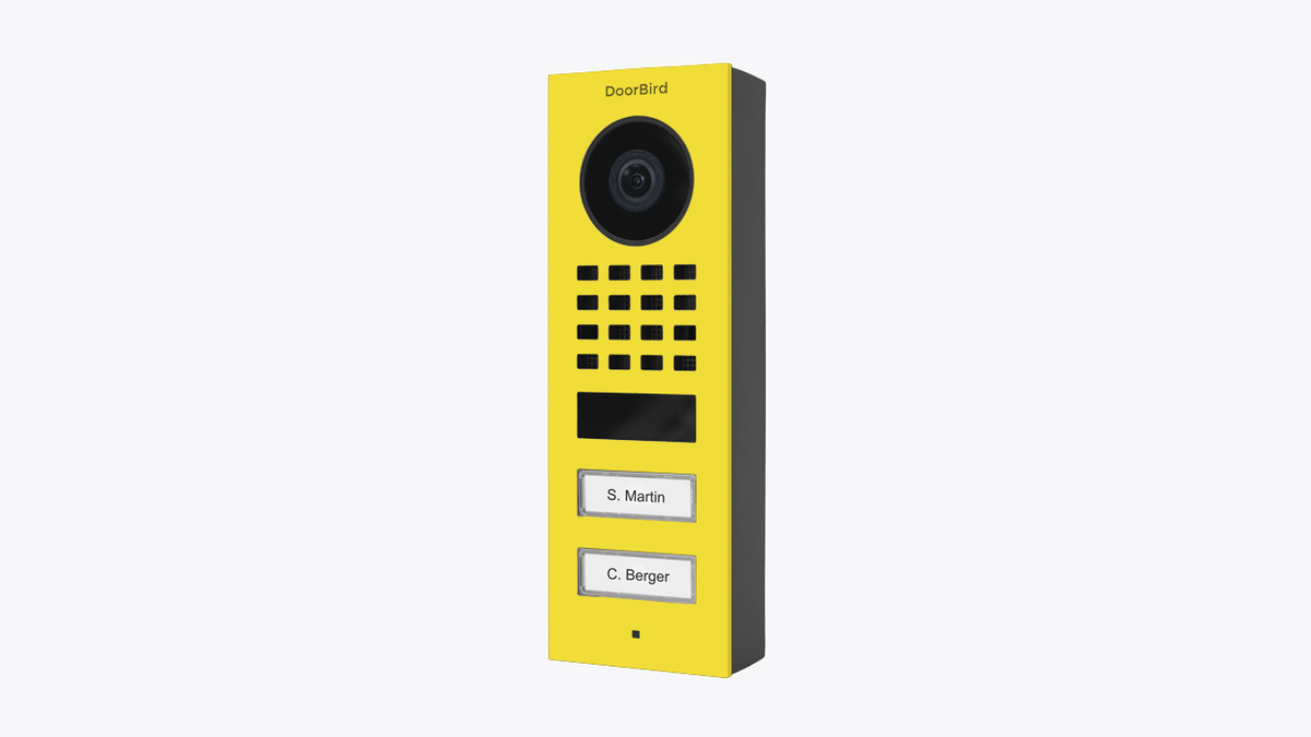 Sulfur yellow DoorBird surface-mount video door station with camera, grille and two name buttons