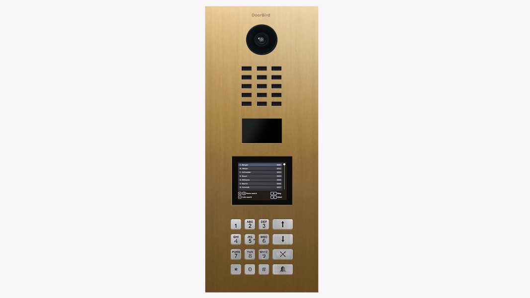 Gold DoorBird video door station with camera lens, speaker grille, keypad and display panel
