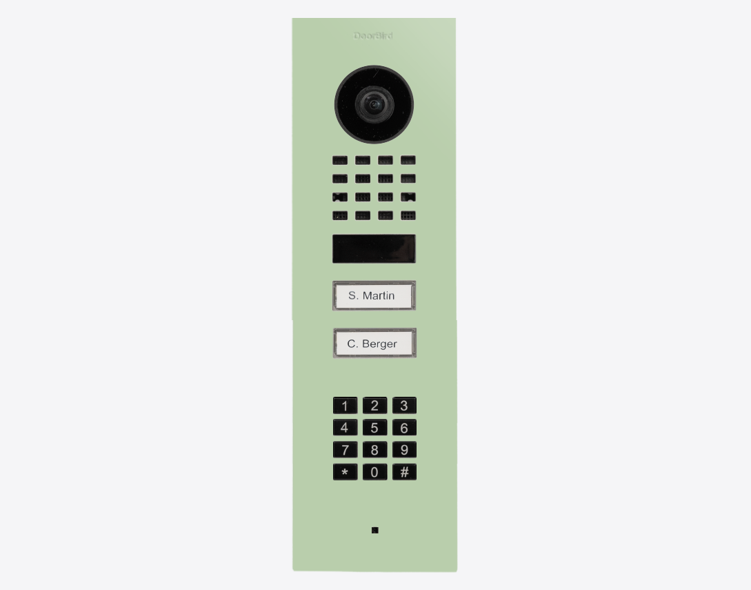 DoorBird flush-mount video door station, pastel green panel with camera, keypad and call buttons