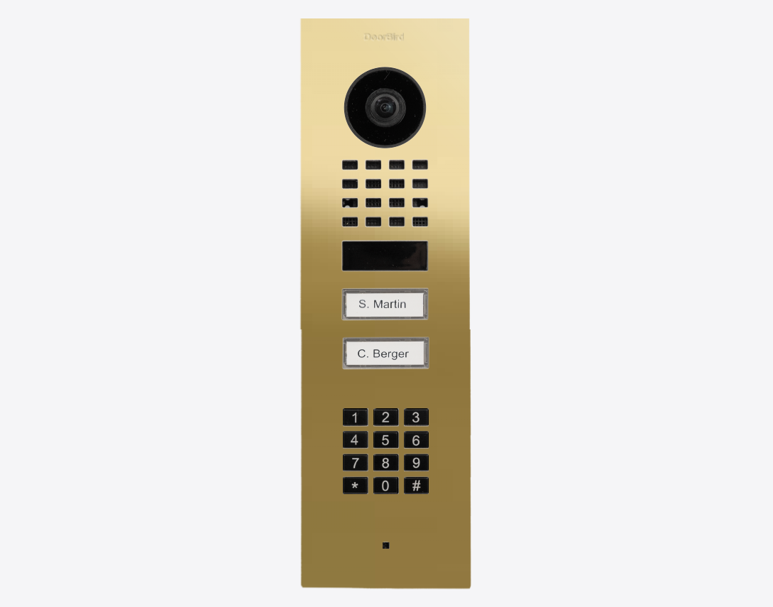 DoorBird brass flush-mount IP video door station with camera, keypad, and two call buttons