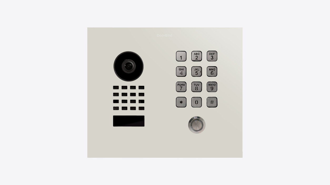 DoorBird flush-mount IP video door station with camera lens, keypad and call button ring