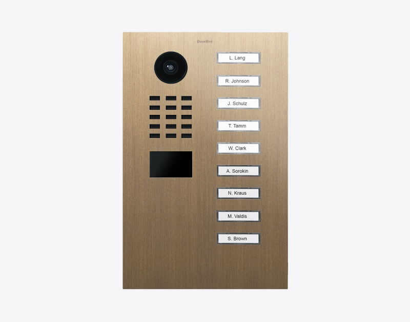 DoorBird video door station in burnished brass with 9 call buttons and camera lens