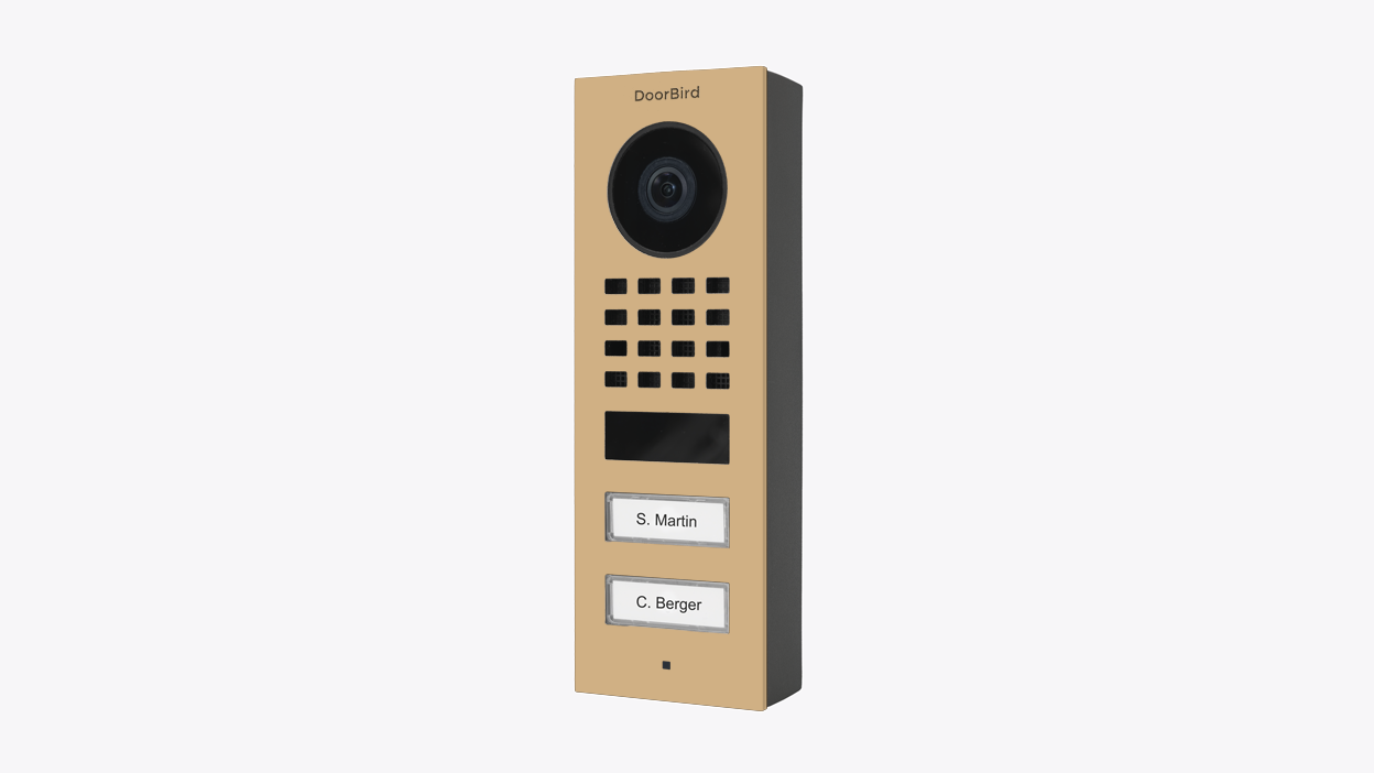 DoorBird video door station in beige with camera lens and speaker grille