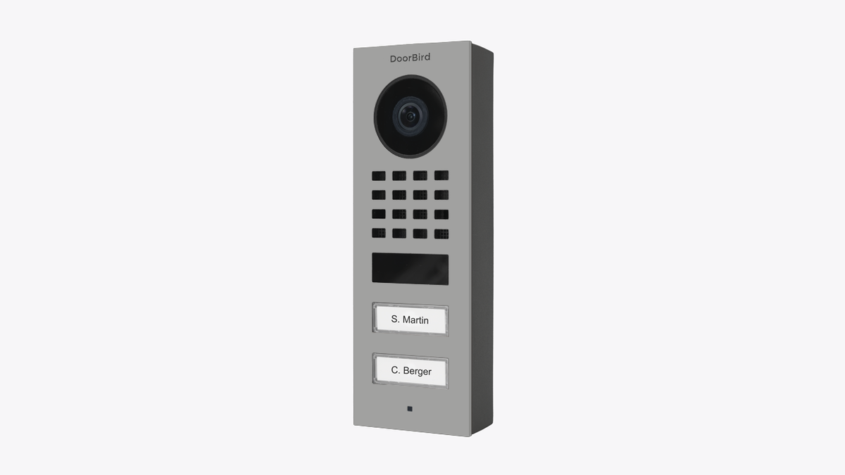 DoorBird D1102V surface-mount video door station in white aluminum, front camera and call buttons