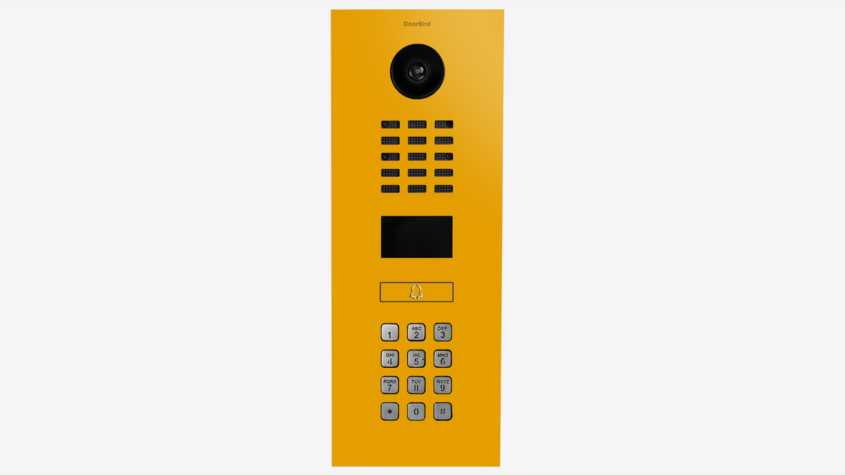 DoorBird video intercom panel, golden yellow housing with camera lens and keypad