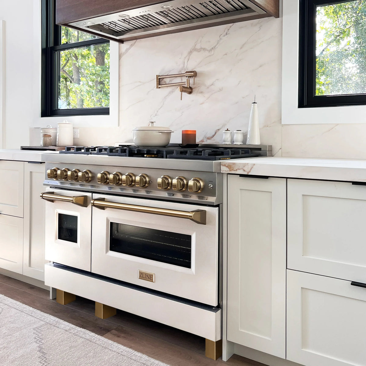 ZLINE Legacy Series Autograph Edition 48-inch Dual Fuel Range with Gas Stove and 6.0 Cu. Ft. Electric Oven in Stainless Steel with White Matte Door and Champagne Bronze Accents in a kitchen
