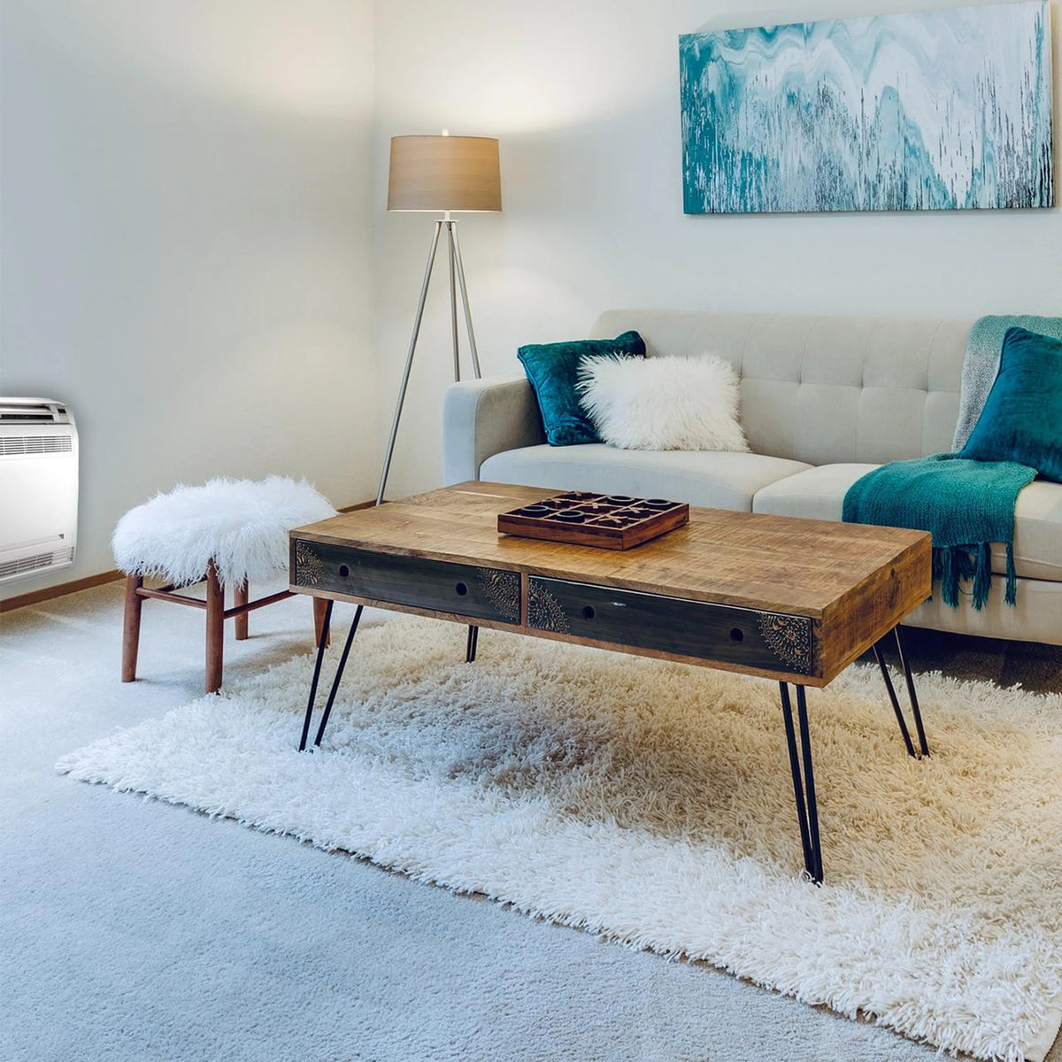White floor-mounted ductless mini split air handler with grille in a modern living room