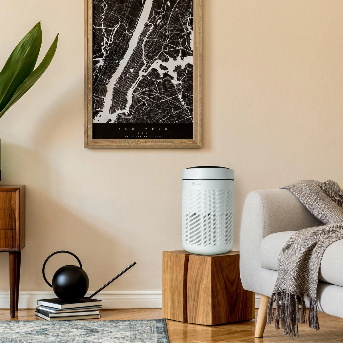 White cylindrical air purifier on stand with side perforation pattern