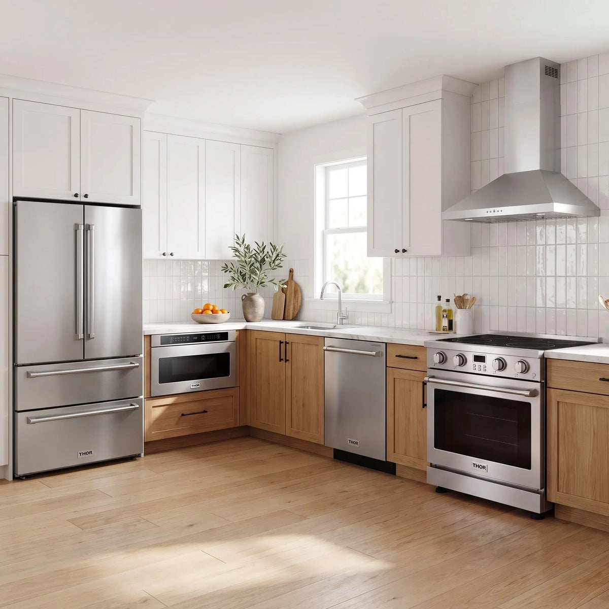 Thor Kitchen A-Series stainless steel kitchen with a 30-inch electric range, wall-mount chimney hood, French door refrigerator, dishwasher and microwave drawer