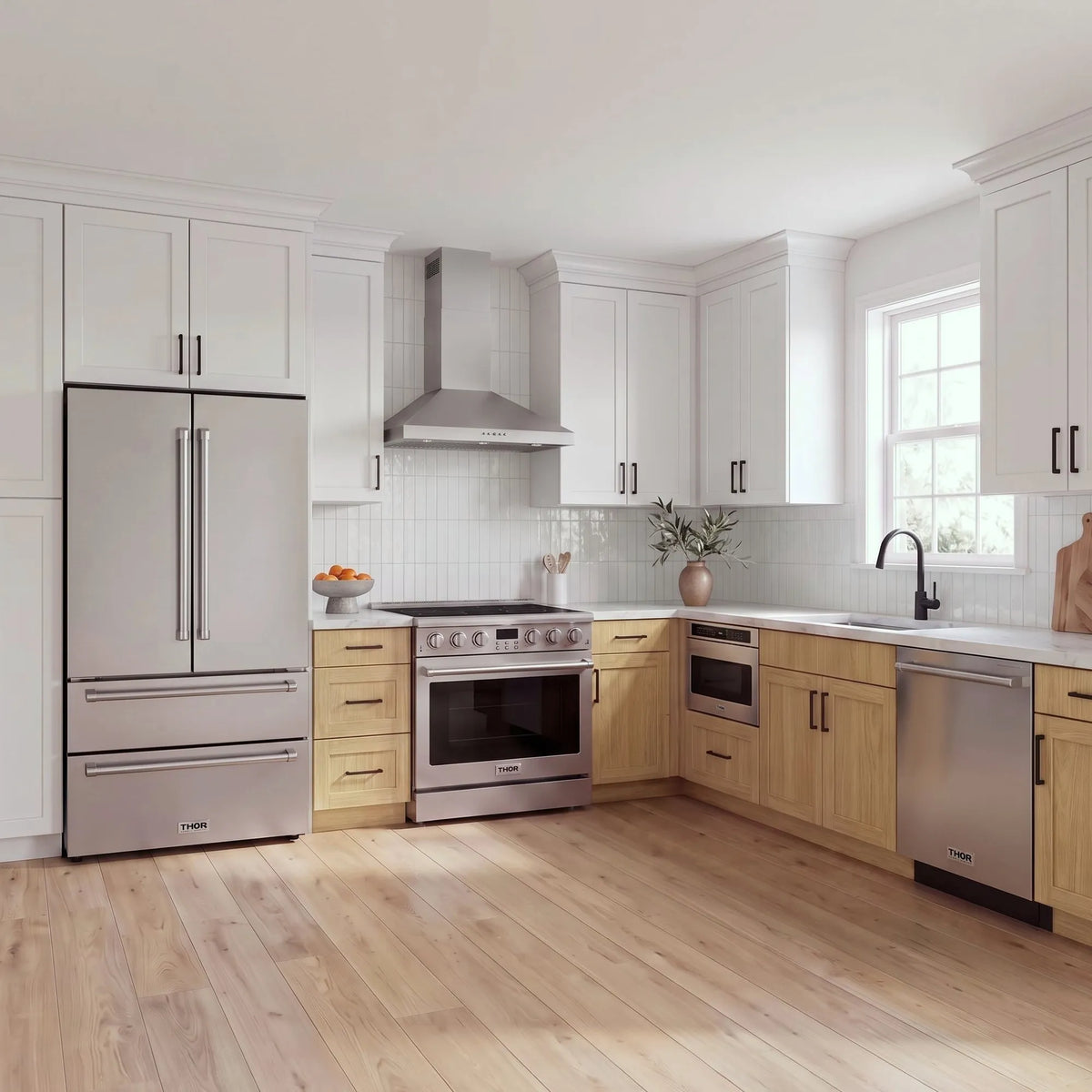 Thor Kitchen A-Series stainless steel kitchen with a 36-inch electric range, wall-mount chimney hood, French door refrigerator, dishwasher and microwave drawer