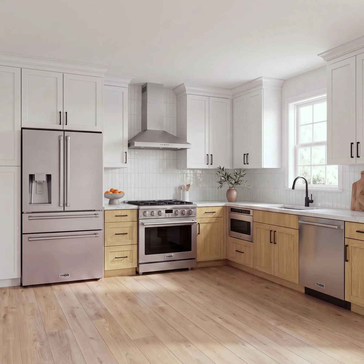 Thor Kitchen A-Series stainless steel kitchen with a 36-inch gas range, wall-mount chimney hood, French door refrigerator, dishwasher and microwave drawer