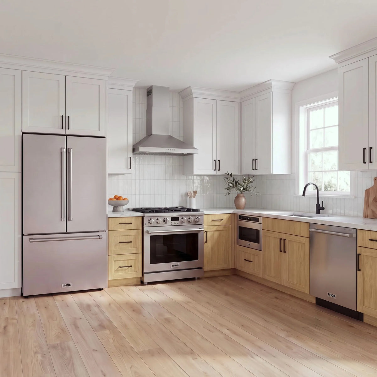 Thor Kitchen A-Series stainless steel kitchen with a 36-inch gas range, wall-mount chimney hood, French door refrigerator, dishwasher and microwave drawer