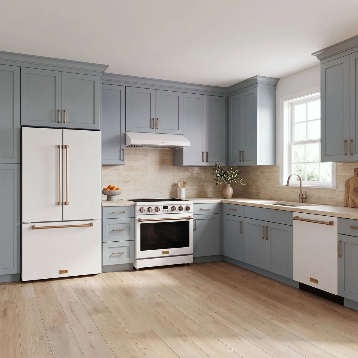 Thor Kitchen A-Series white and bronze kitchen with a 36-inch electric range, under-cabinet hood, French door refrigerator, dishwasher