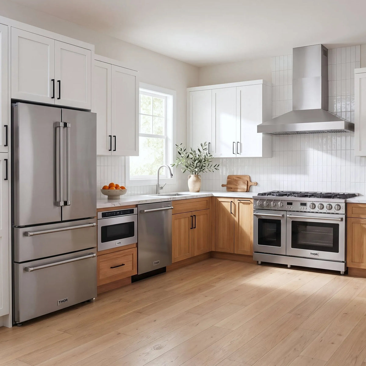 Thor Kitchen A-Series stainless steel kitchen with a 48-inch gas range, wall-mount chimney hood, French door refrigerator, dishwasher and microwave drawer