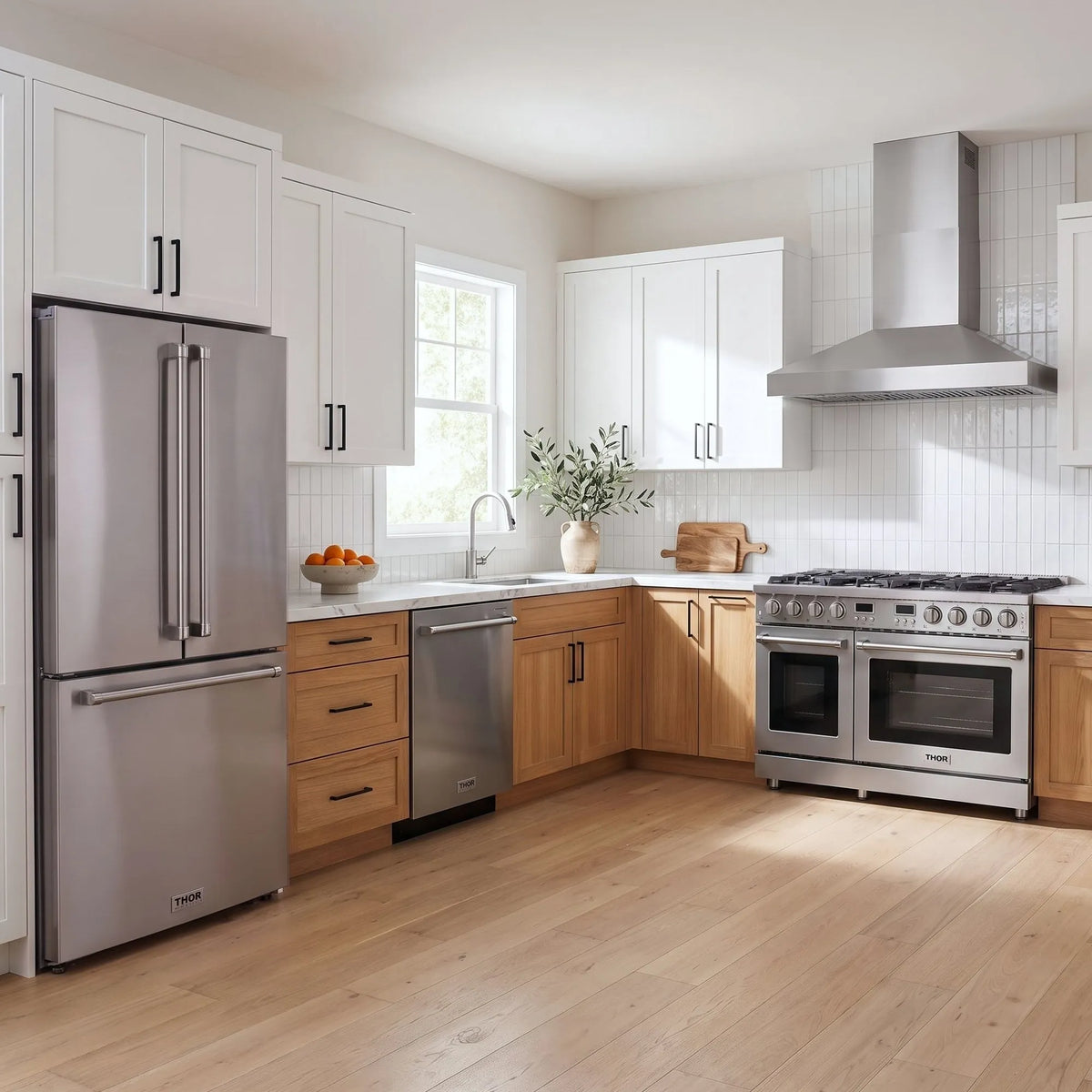 Thor Kitchen A-Series stainless steel kitchen with a 48-inch gas range, wall-mount chimney hood, French door refrigerator, dishwasher