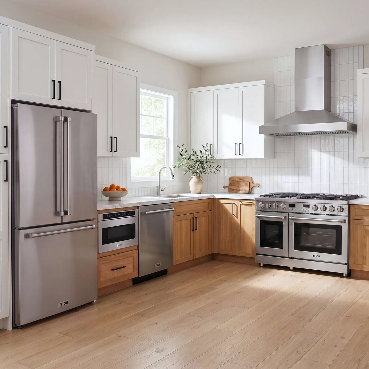Thor Kitchen A-Series stainless steel kitchen with a 48-inch gas range, wall-mount chimney hood, French door refrigerator, dishwasher and microwave drawer
