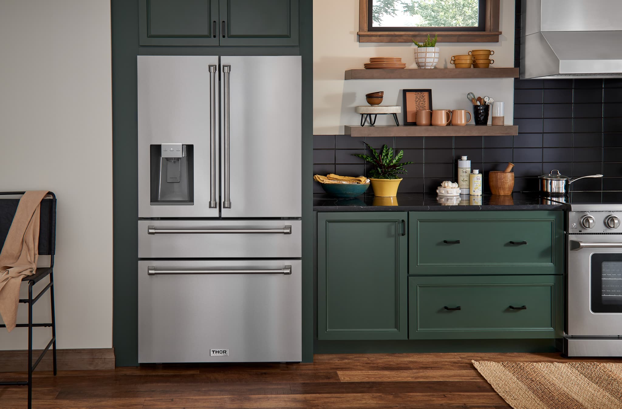 Stainless steel French door refrigerator with water dispenser and freezer drawer