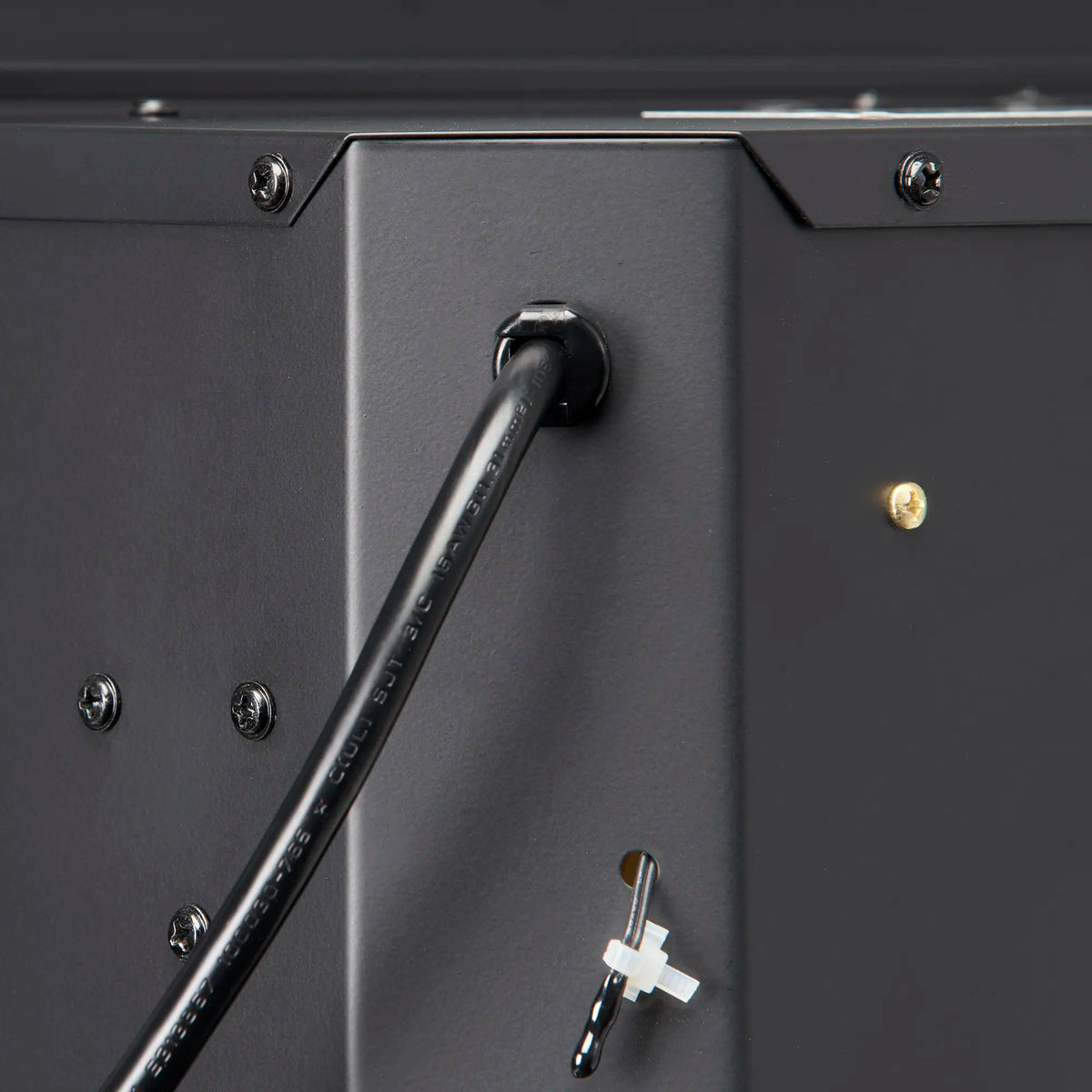 Electric firebox control side with black power switch and accessory key handle