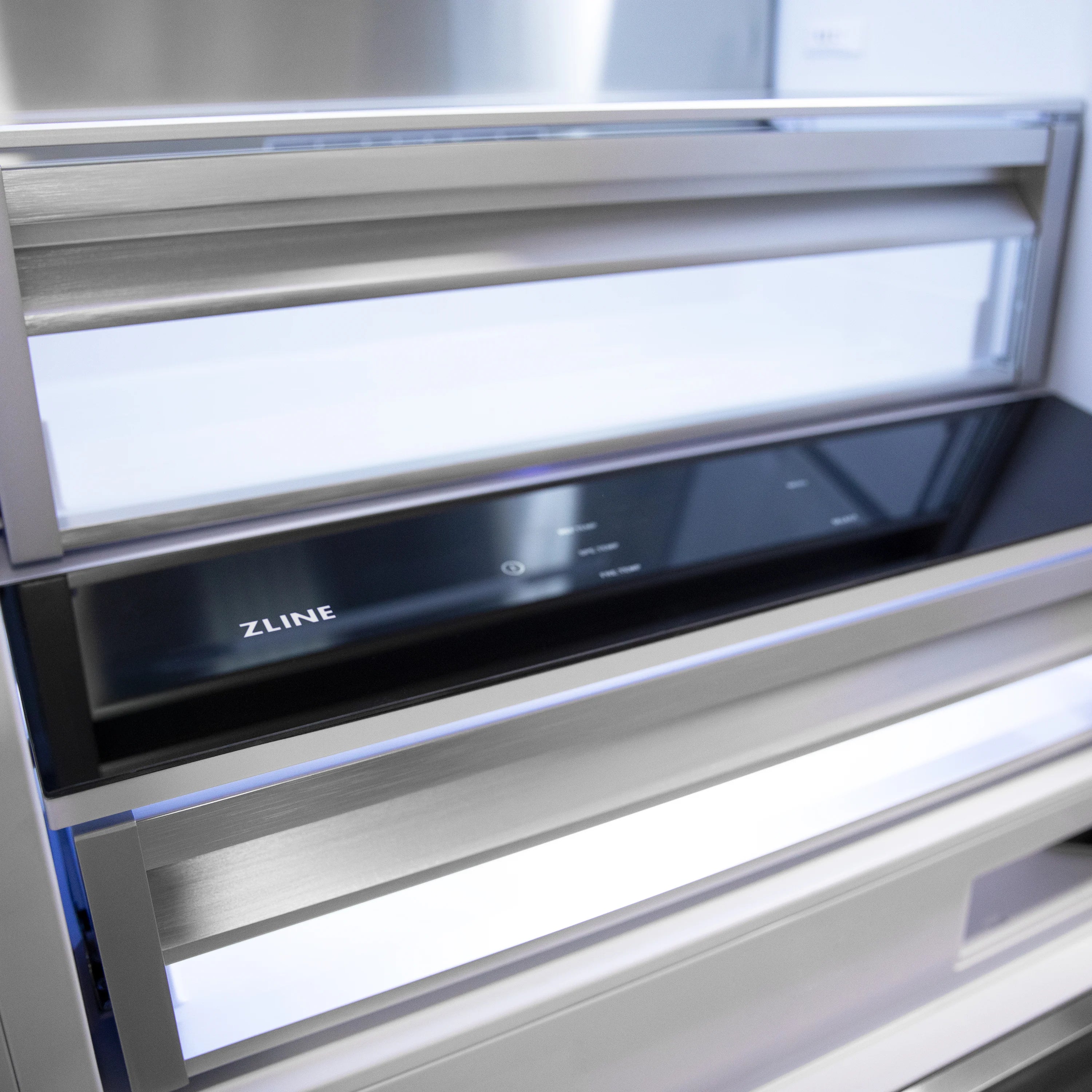 ZLINE branded bottom-freezer control panel with black glass display and silver trim