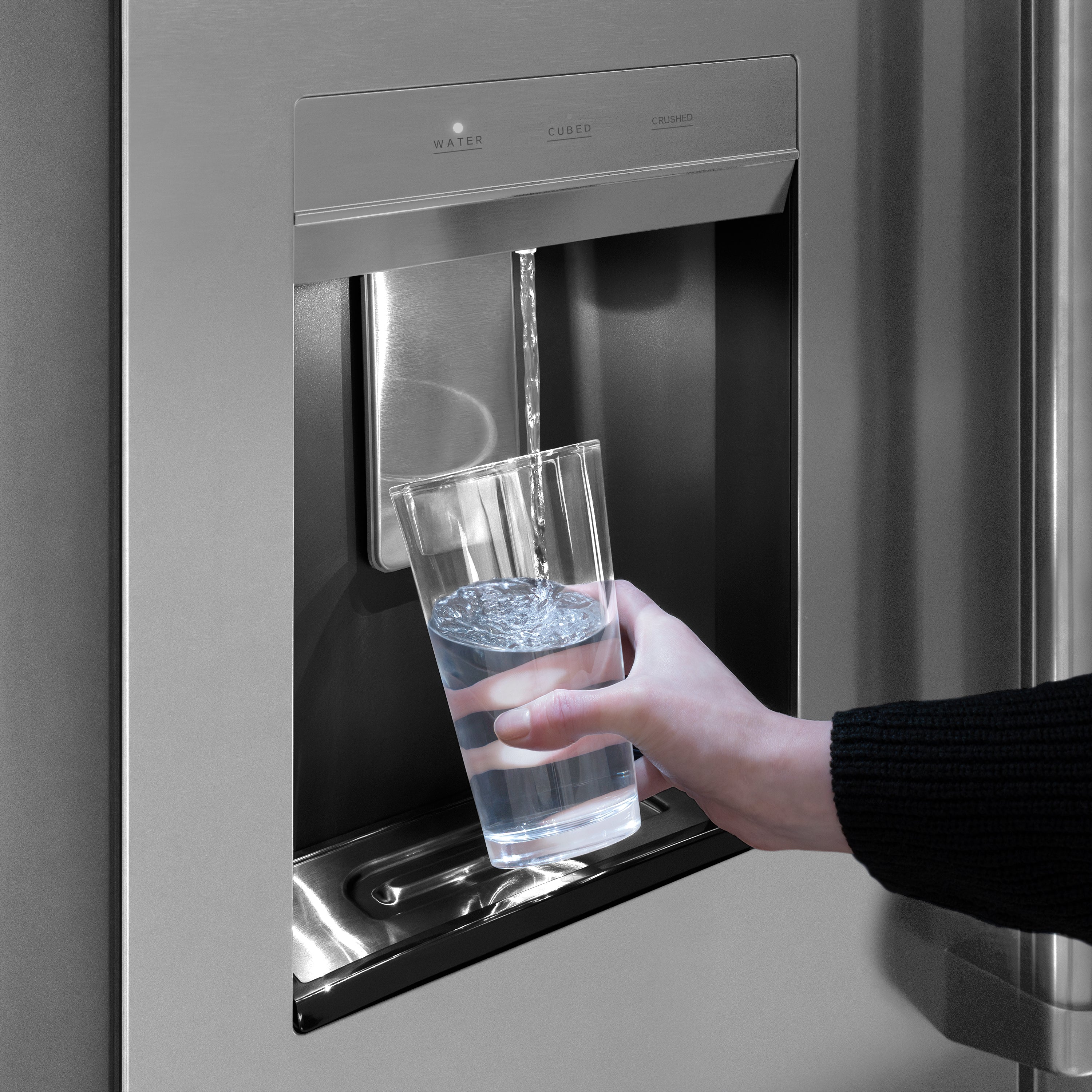 External water dispenser filling a glass with cold water
