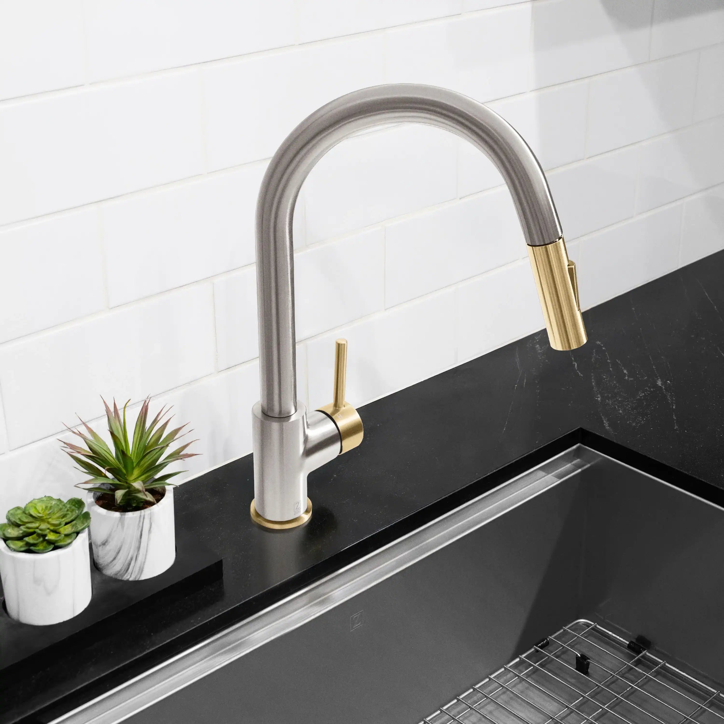 Pull-down kitchen faucet in brushed nickel with champagne bronze spout accent