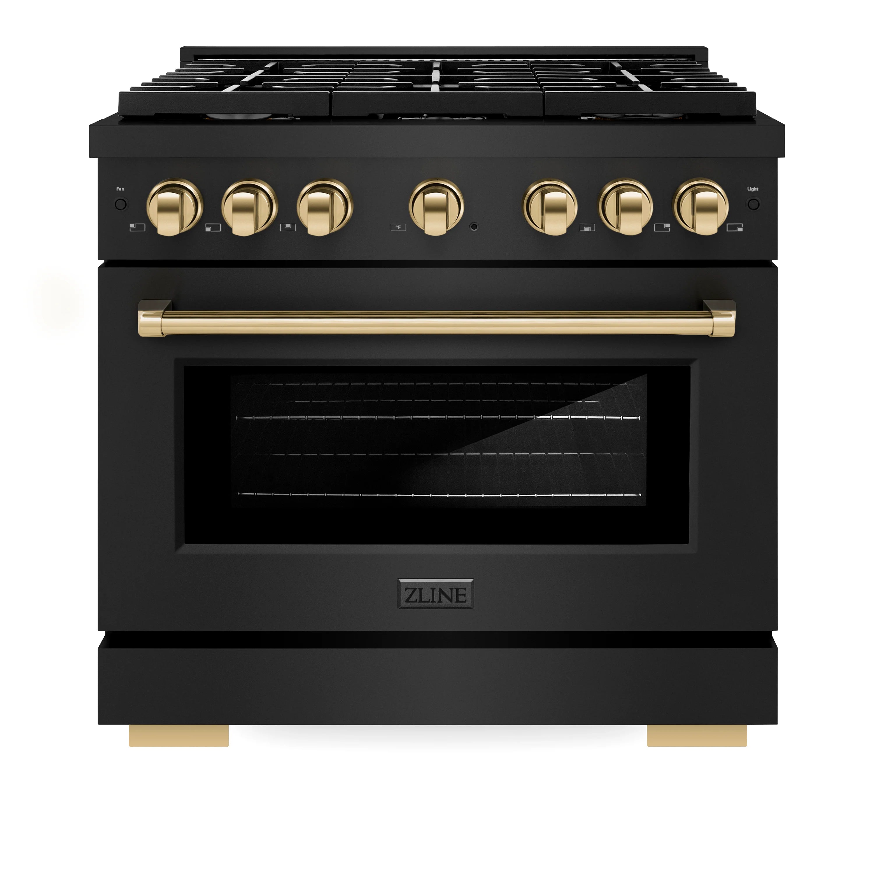 Black gas range with gold control knobs and brass-toned oven handle