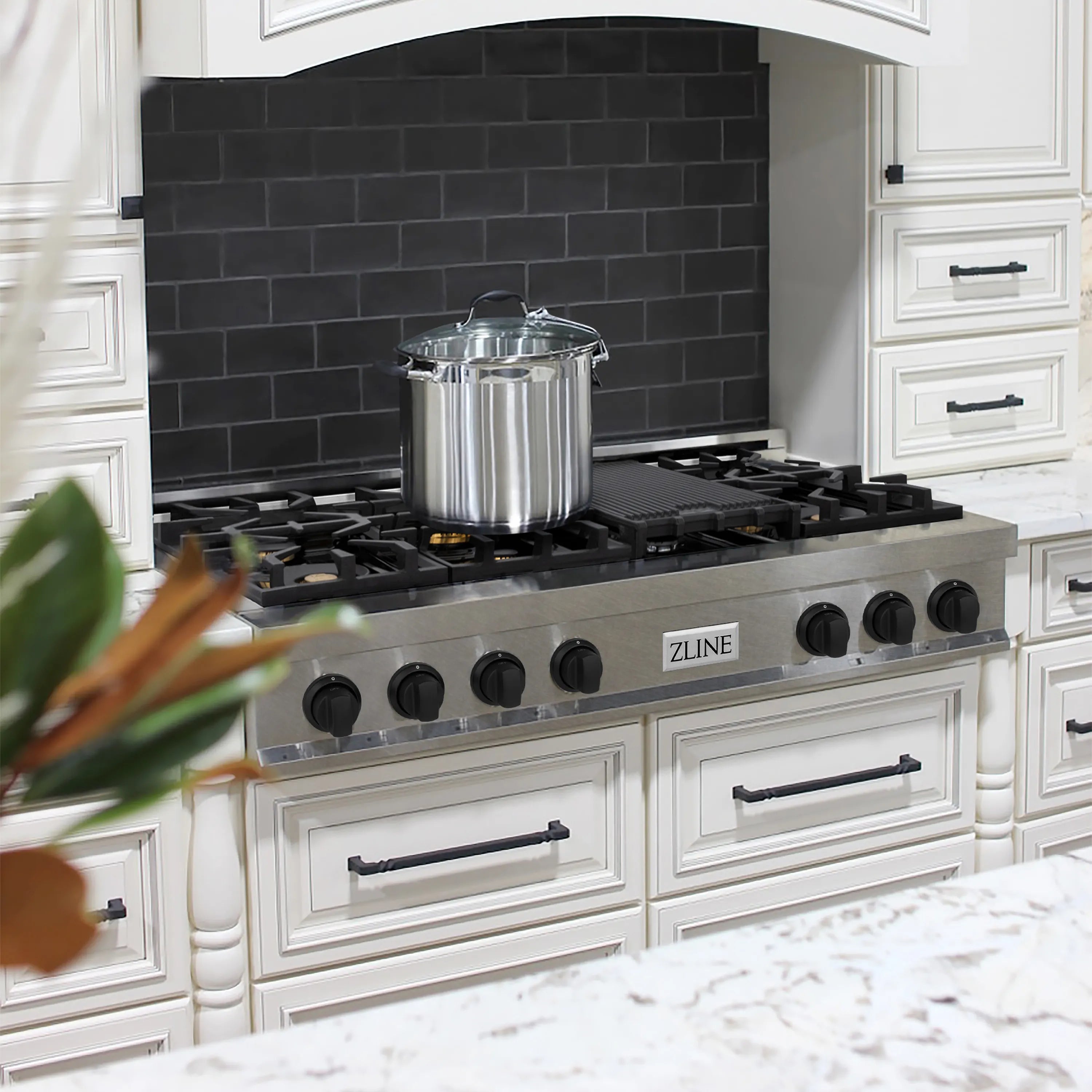 7-burner gas rangetop with black grates and satin stainless steel control panel