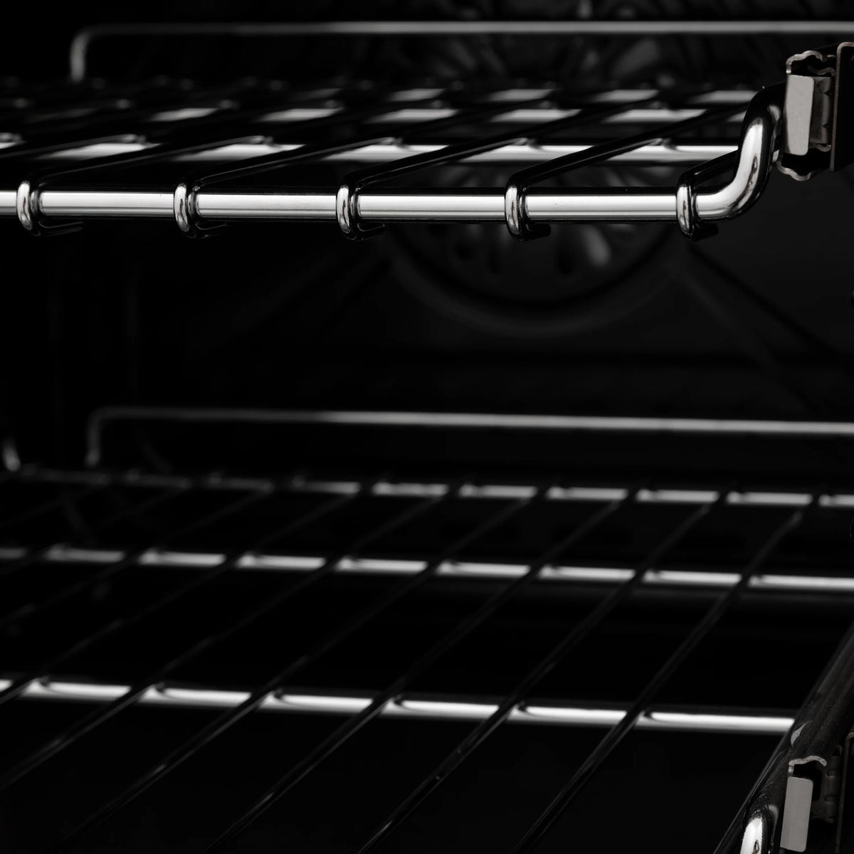 Oven broil element and black wire racks inside the cooking cavity